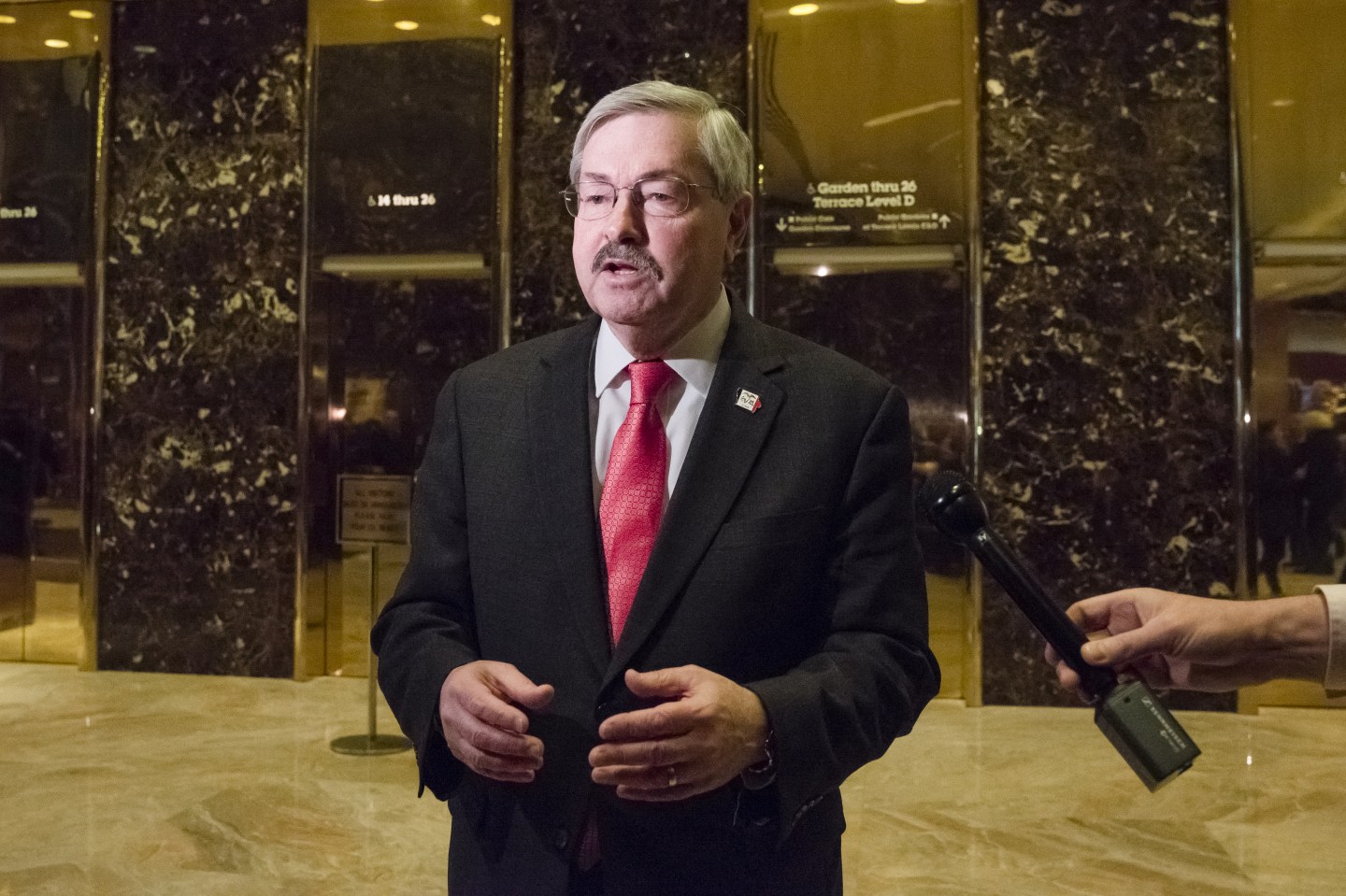 Terry Branstad, governor of Iowa, speaks to members of the media in the lobby at Trump Tower in New York, U.S., on Tuesday, Dec. 6, 2016.