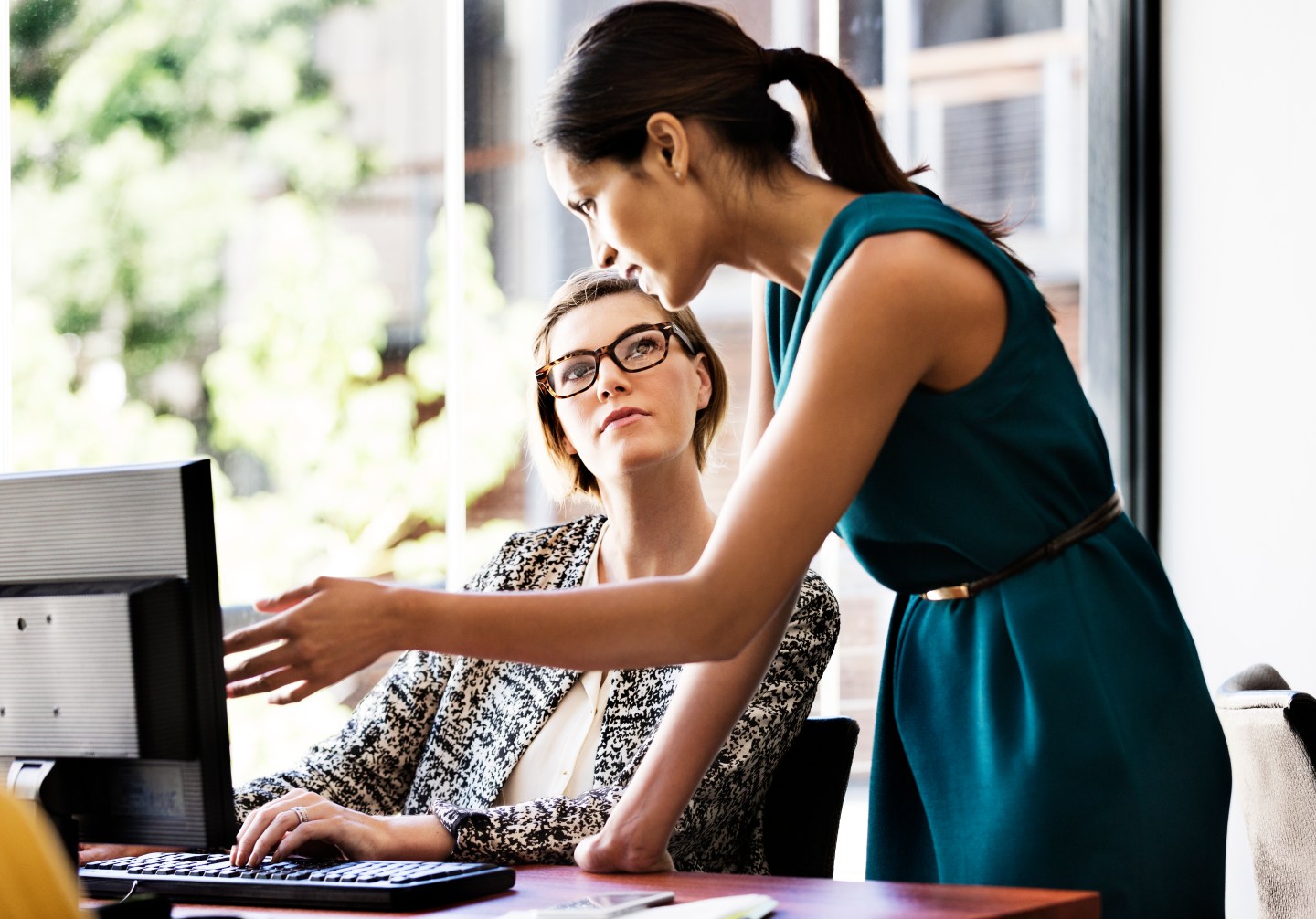 Businesswomen working at computer desk in office