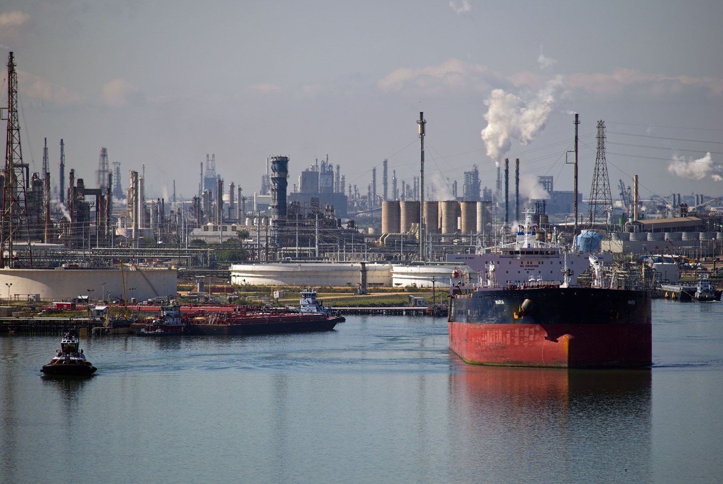 Views Of Tankers & Refineries As Oil Trades Near 12-Year Low