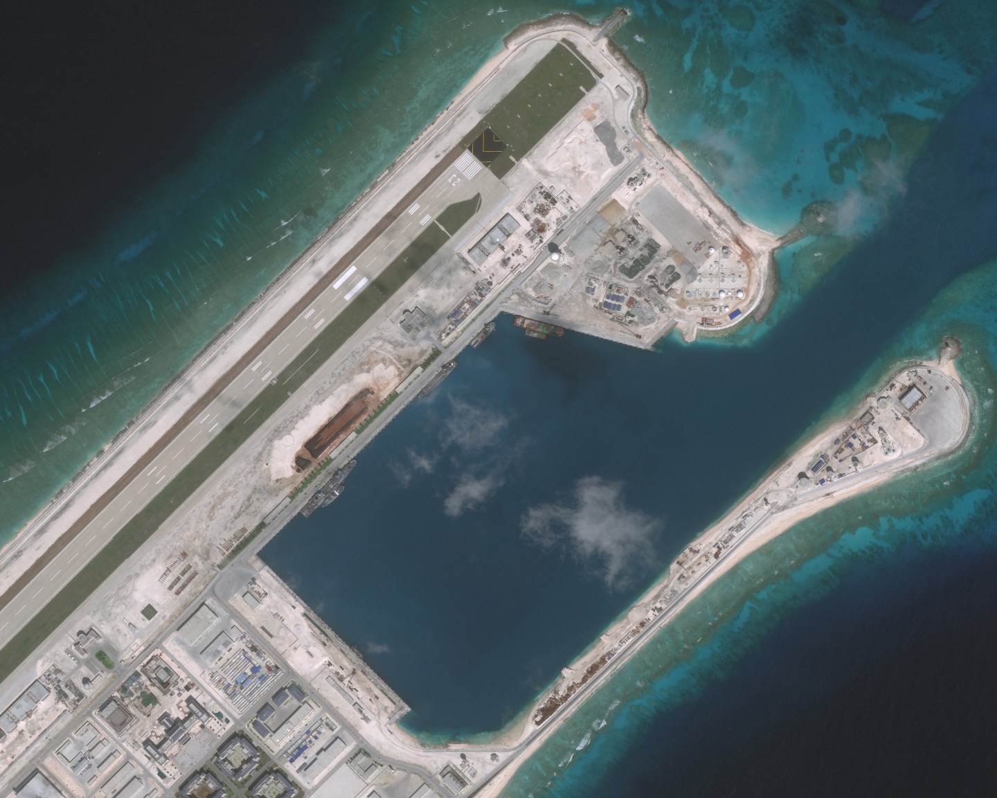 NOV 10, 2016: DigitalGlobe imagery (closeup-2) of the Fiery Cross Reef located in the South China Sea. Fiery Cross is located in the western part of the Spratly Islands group.