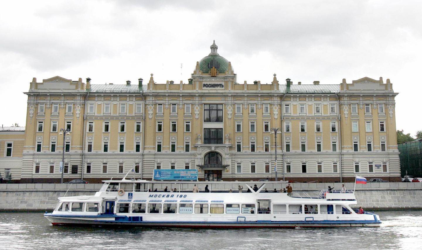 A river bus sails by headquarters of Ros