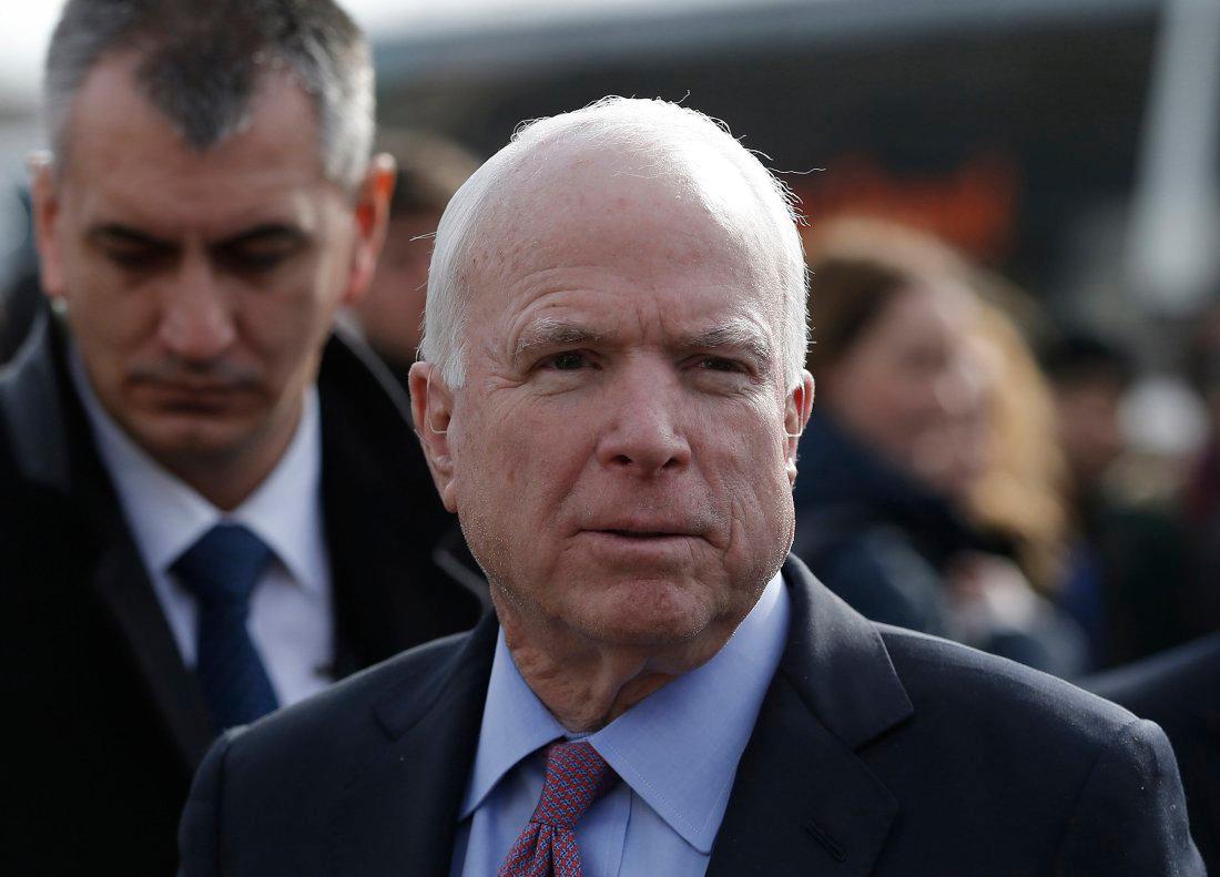 U.S. Senator McCain arrives on a visit at a migrant center near the village of Adasevci