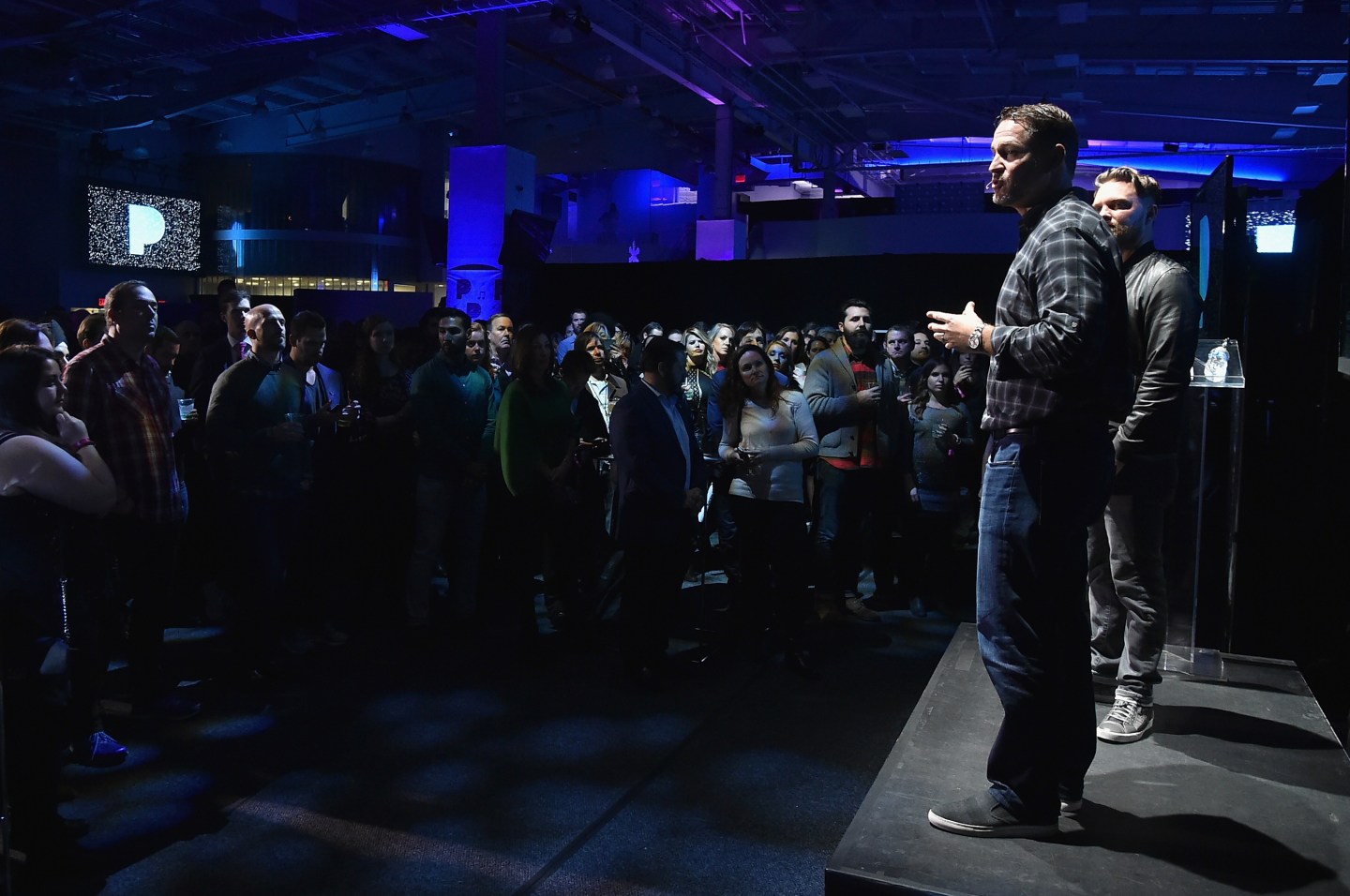 Pandora Radio officials Chris Becherer and Chris Phillips speak on stage at the Pandora Holiday Live event at Pier 36 on Dec. 6, 2016 in New York City.