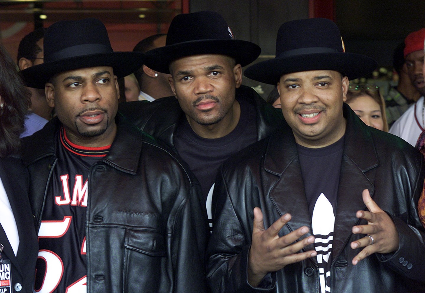 MEMBERS OF THE MUSICAL GROUP RUN-DMC POSE AT HOLLYWOOD'S ROCKWALK.