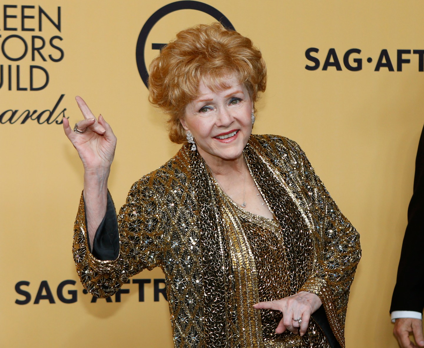 Actress Debbie Reynolds poses backstage after accepting her Lifetime Achievement awards at the 21st annual Screen Actors Guild Awards in Los Angeles