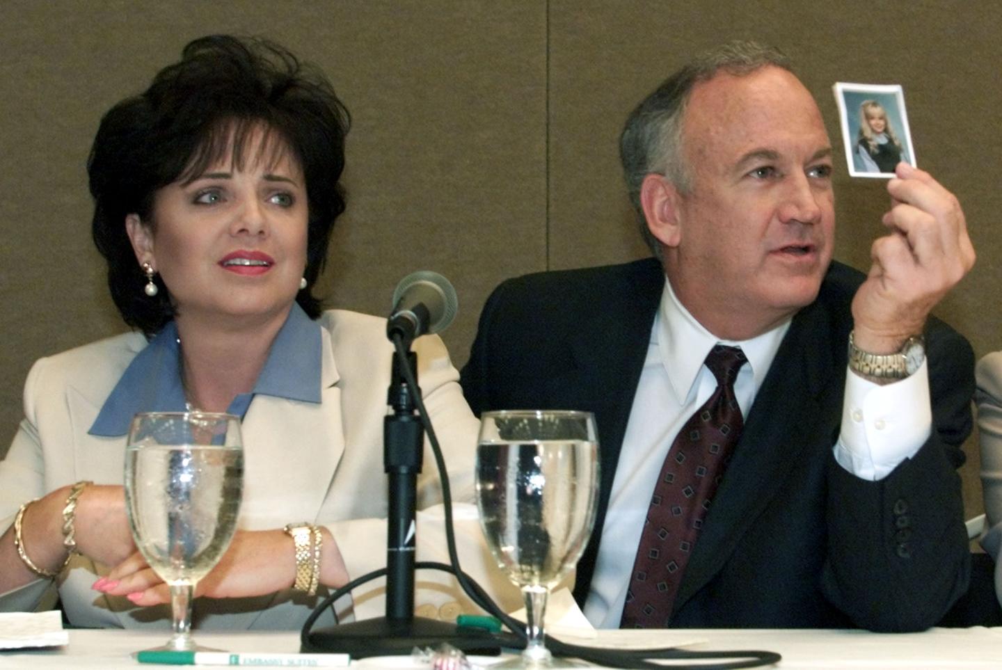 File photo of Patsy Ramsey and her husband, John Ramsey producing a picture of Jon-Benet Ramsey during a press conference in Atlanta