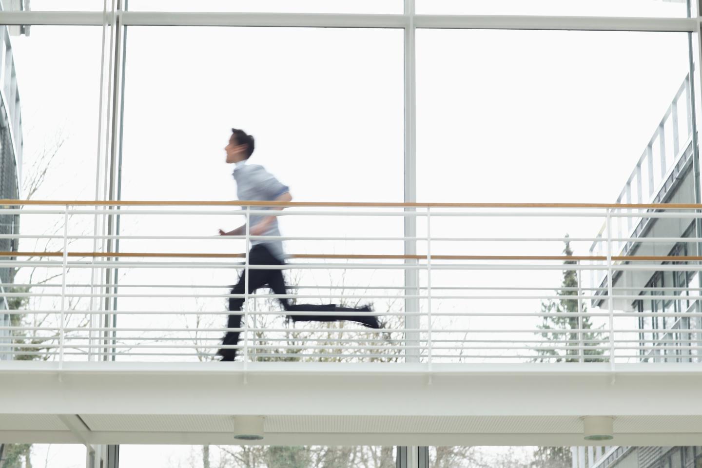 Teenage boy running on walkway