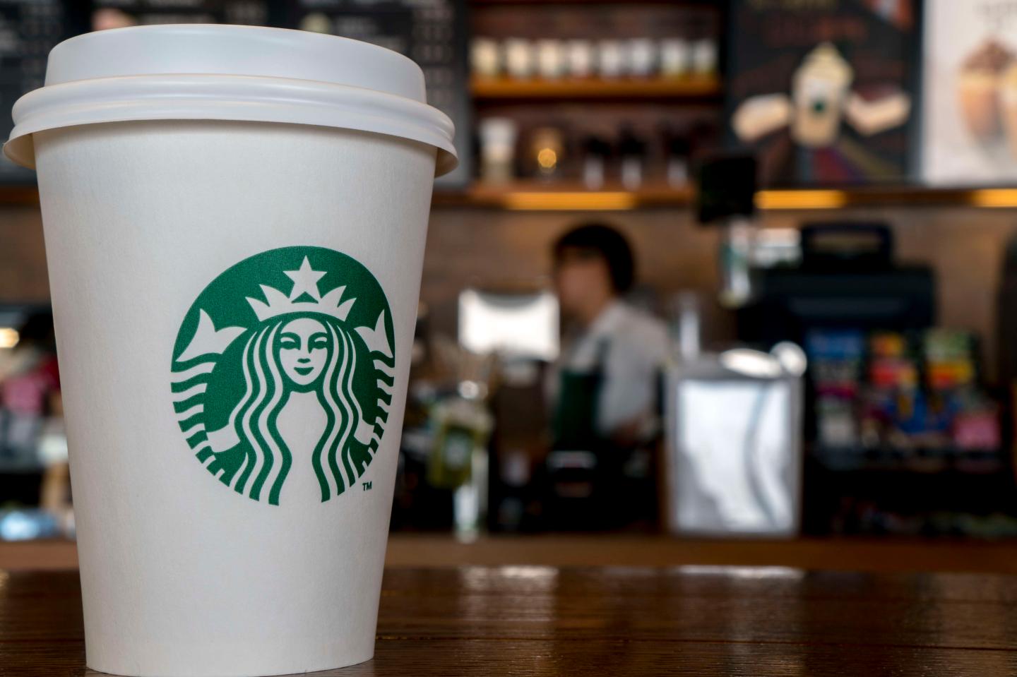 Paper cup in a Starbucks coffee shop. During the third