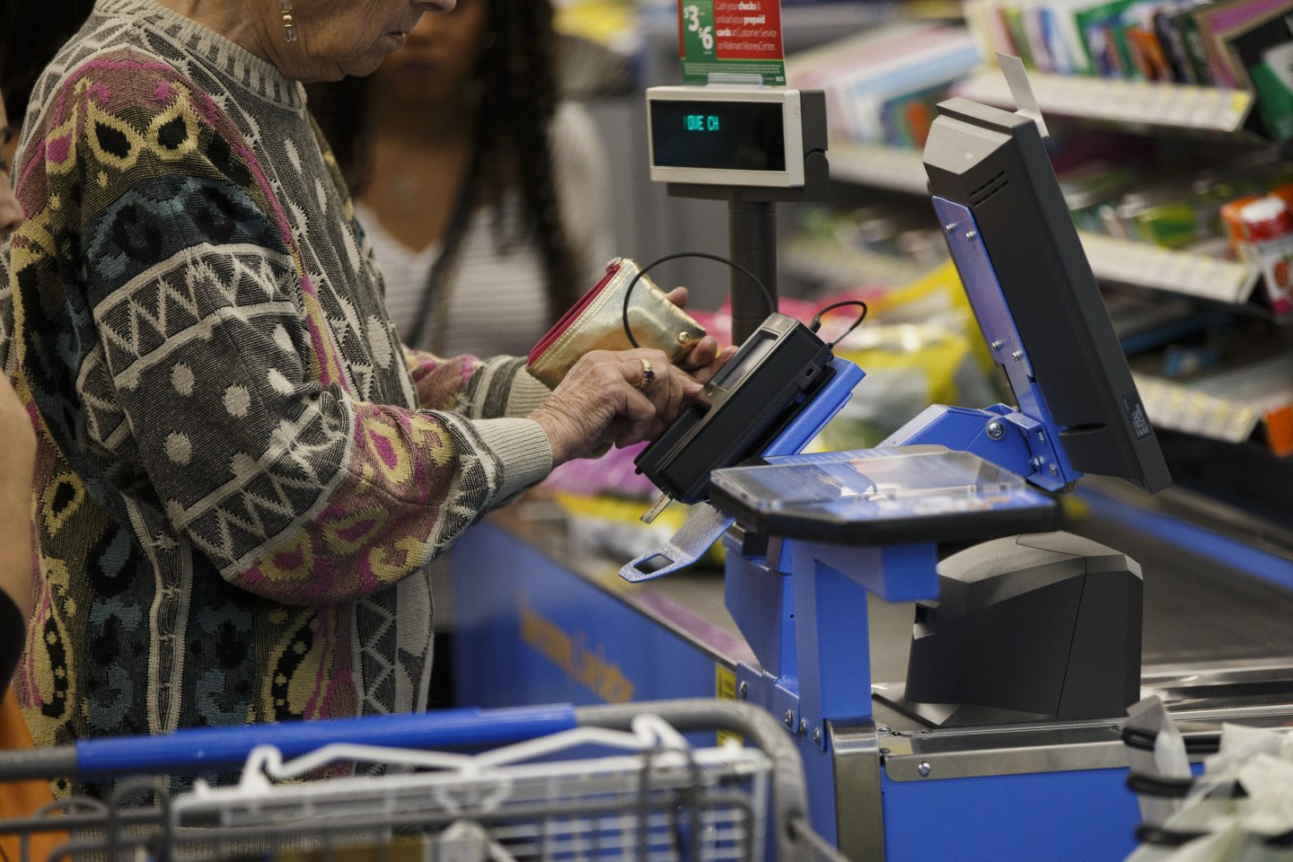 A customer uses a chip credit card terminal at a Wal-Mart Stores Inc. location in Burbank, California on Nov. 22, 2016.