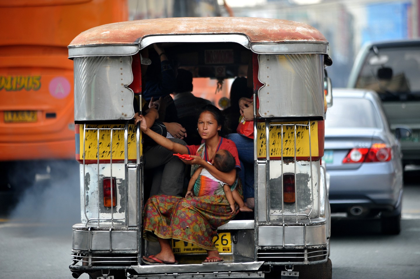 A homeless mother with her baby rides on