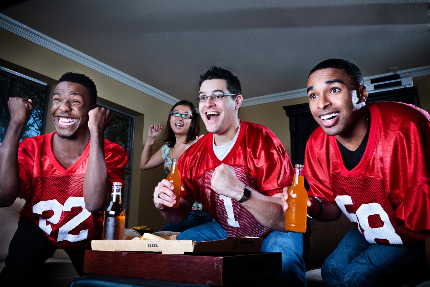 friends watching football on TV