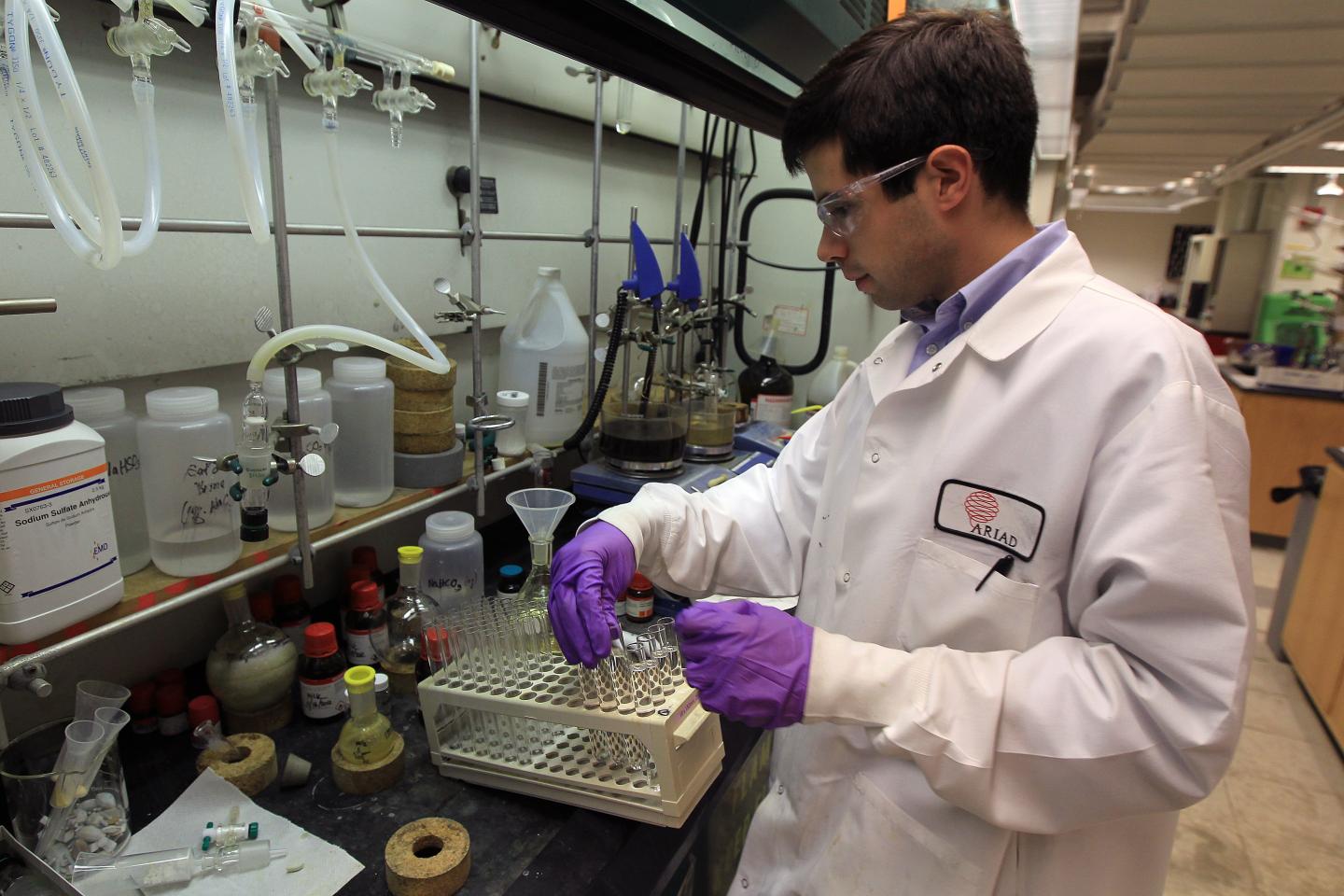 An Ariad Pharmaceuticals chemist working in the company’s lab.