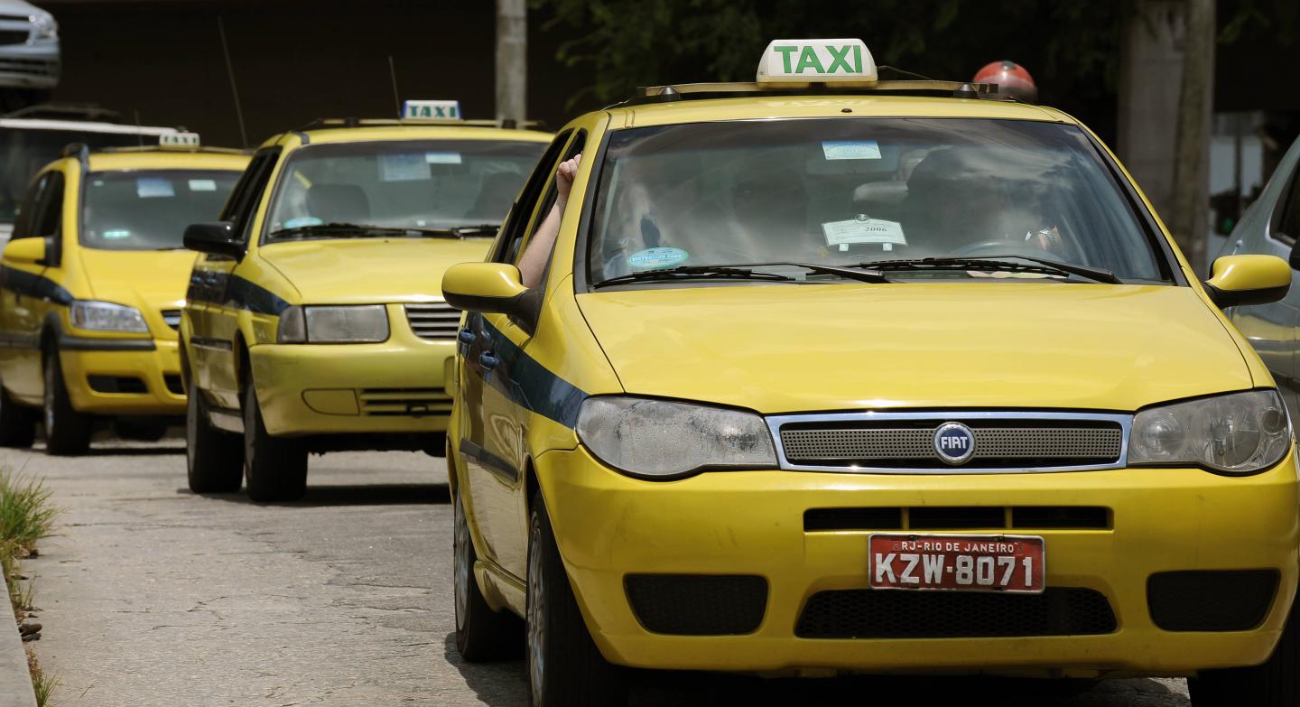 Taxis drive in a street of Rio de Janeir