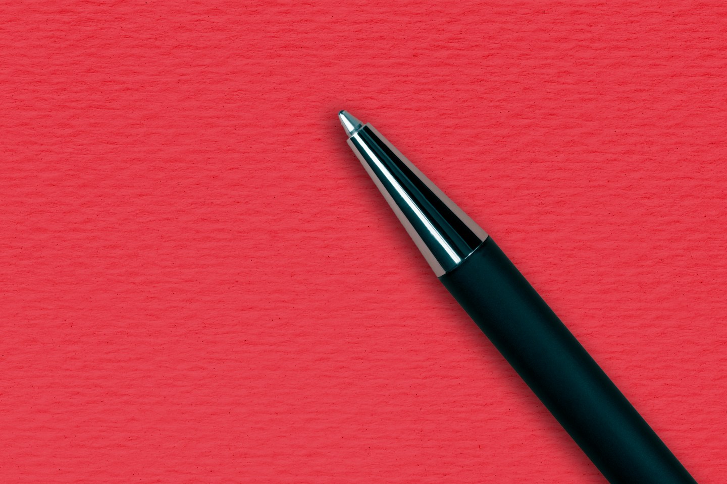 Black ball pen on the red papper background