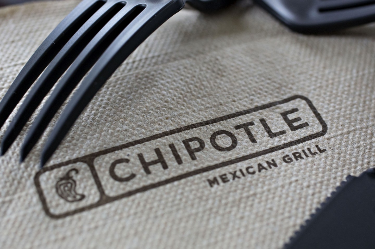 Chipotle Mexican Grill Inc. signage is seen on a napkin arranged for a photograph in Tiskilwa, Illinois, U.S., on Friday, April 22, 2016.
