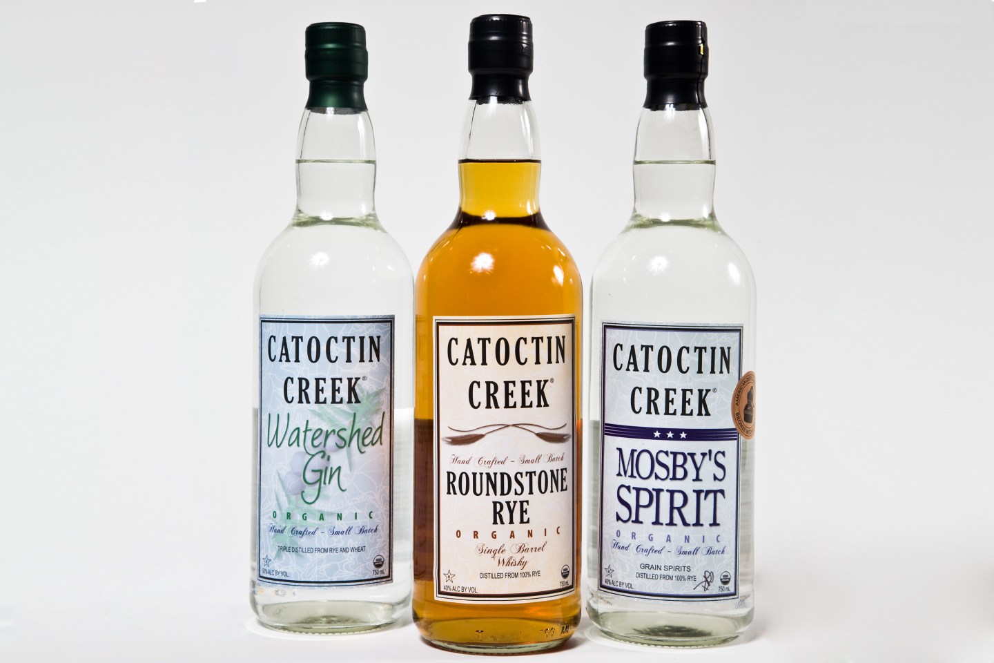 Bottles of Watershed Gin, Roundstone Rye Whisky and Mosby's Spirit at Catoctin Creek Distillery in Purcellville Virginia.
