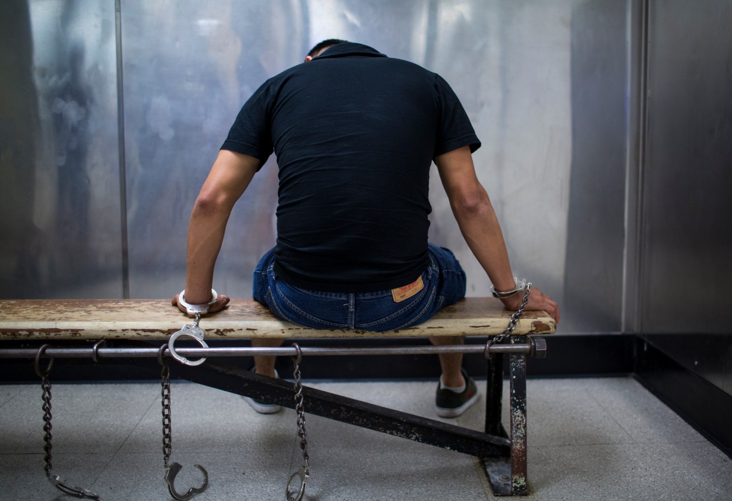 Male Suspect Handcuffed To Bench