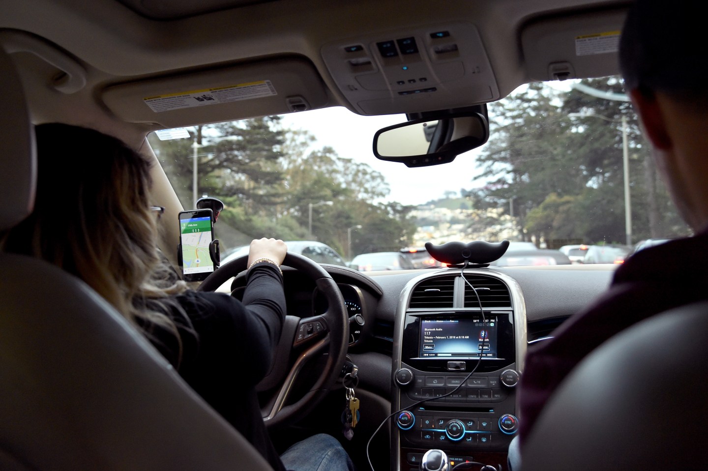 Lyft At Its San Francisco Headquarters Showcasing Lyft Cars, The Glowstache, The Lyft App, Lyft Passengers And Drivers