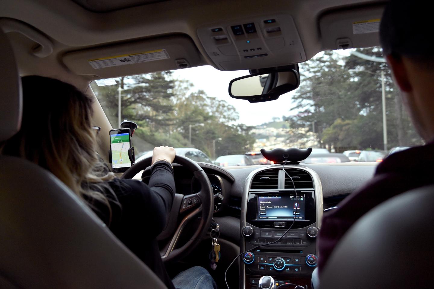 Lyft At Its San Francisco Headquarters Showcasing Lyft Cars, The Glowstache, The Lyft App, Lyft Passengers And Drivers