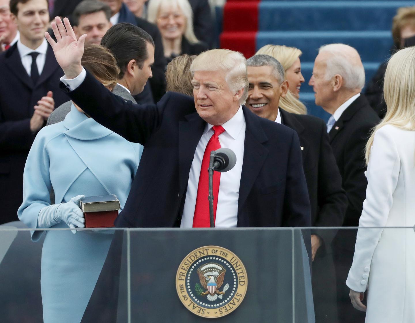 President Donald Trump waves after taking the oath at inauguration ceremonies swearing in Trump as the 45th president of the United States on the West front of the U.S. Capitol in Washington