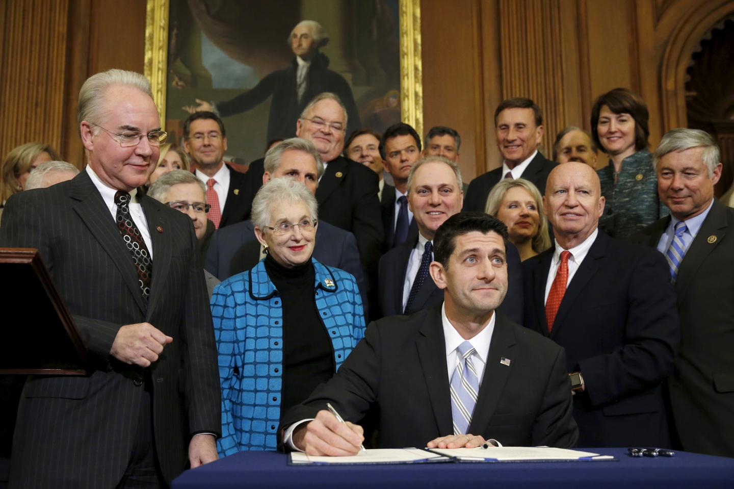 Ryan signs a bill repealing Obamacare at the U.S. Capitol in Washington