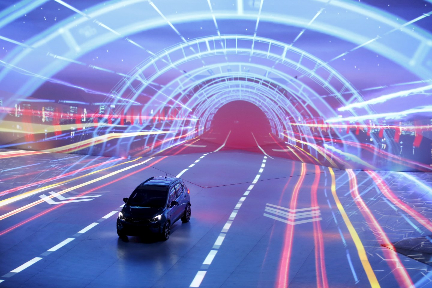 BYD's hybrid electric car 'Yuan' is displayed on a stage at BYD Dreamcast conference in Beijing