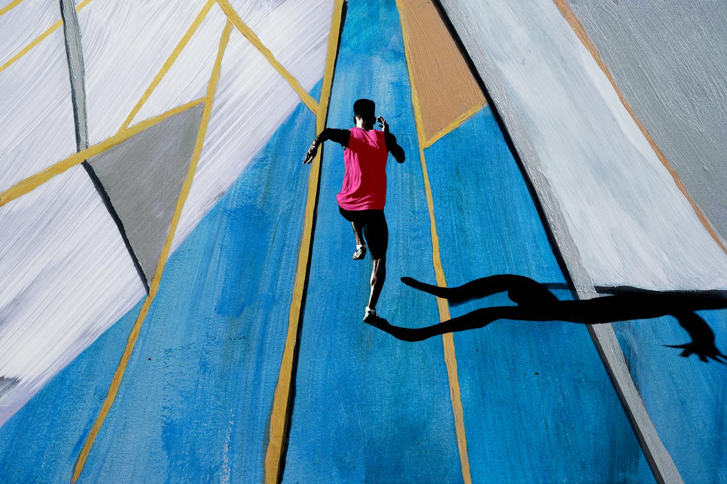 Male athlete sprinting, shot from above