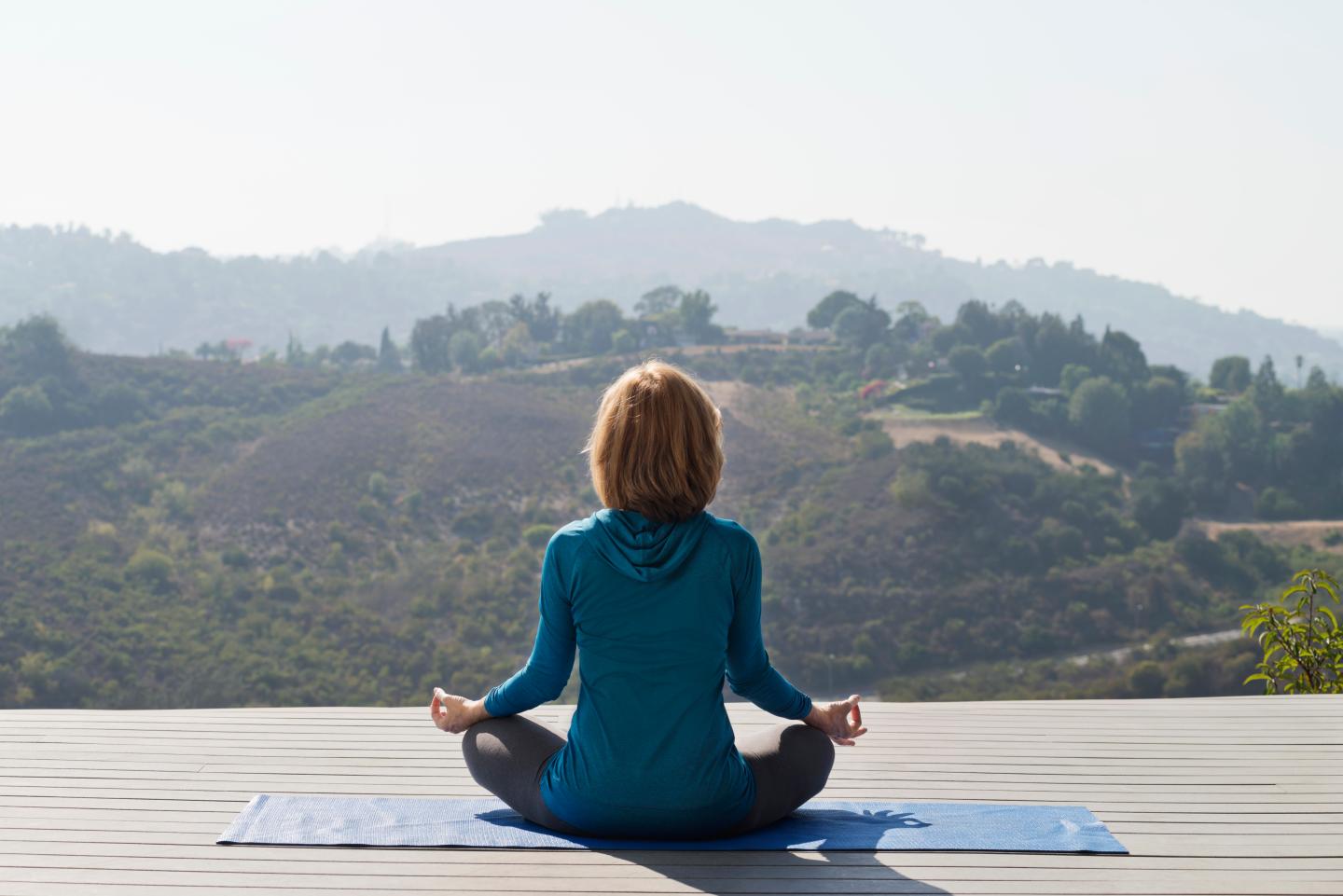 Rear view of woman practicing yoga