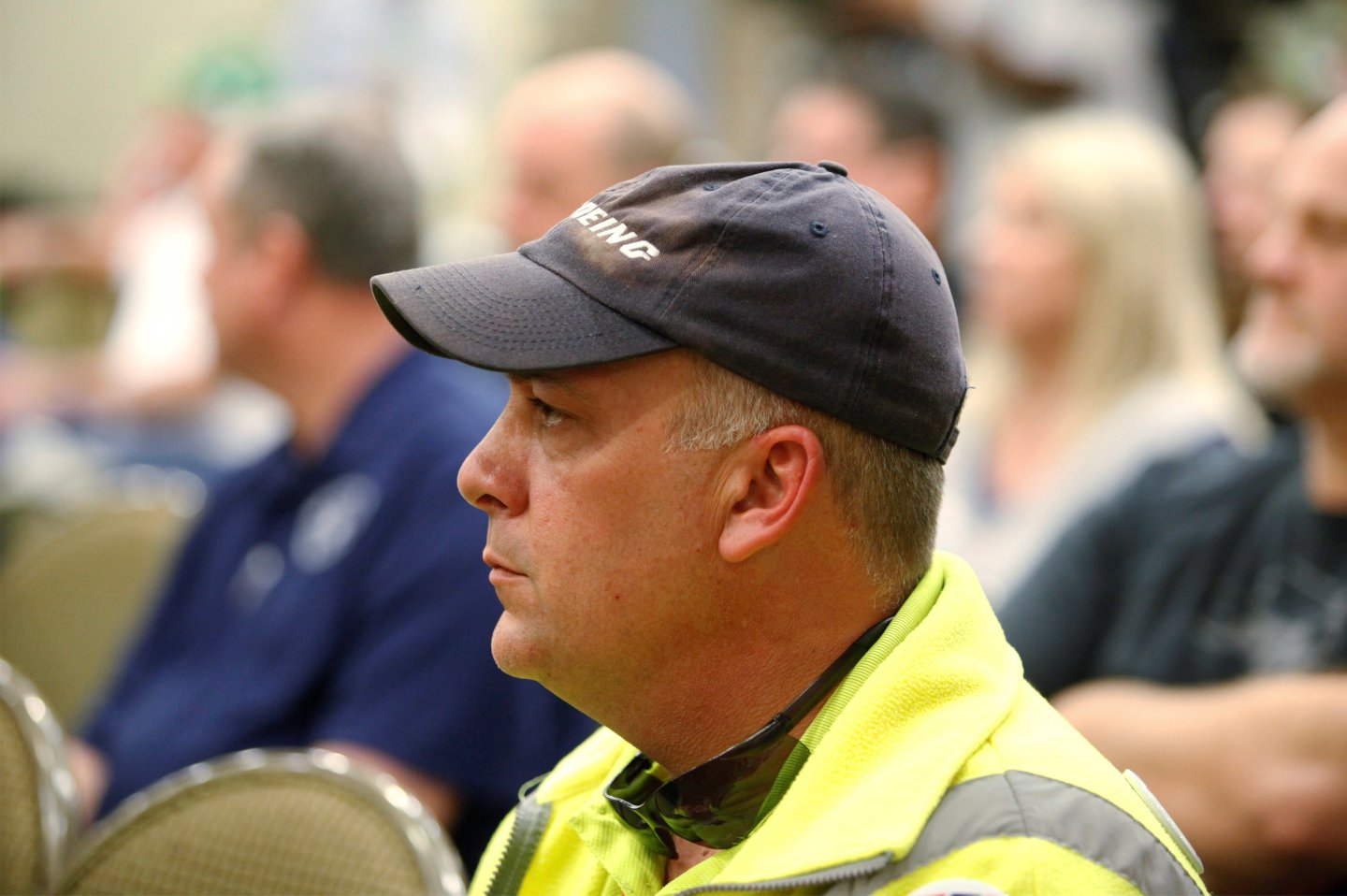 Boeing worker Chris Jones of Summerville, listens with other workers at a rally held by The International Association of Machinists and Aerospace Workers for Boeing South Carolina workers before Wednesday's vote to organize, in North Charleston