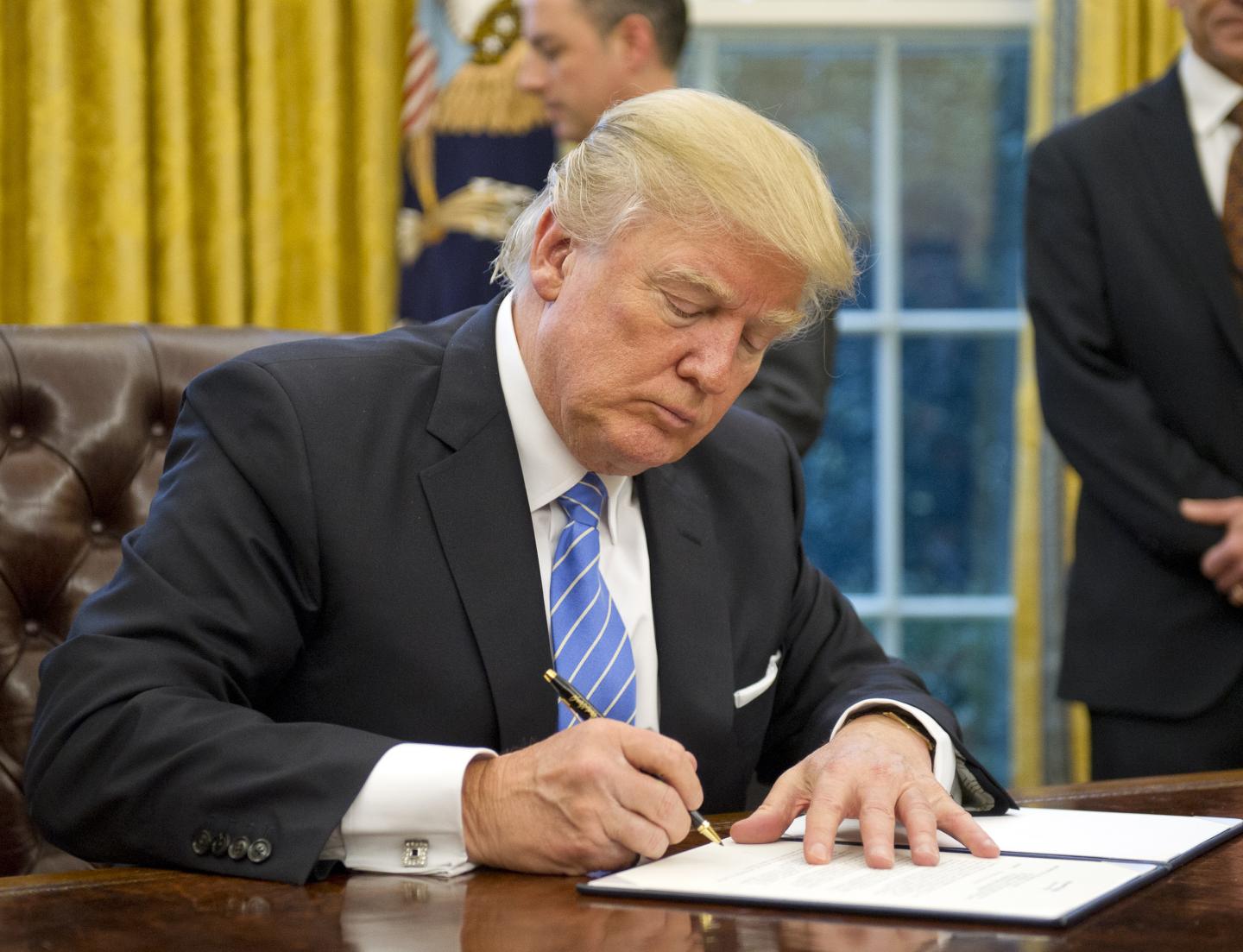 President Trump Signs Executive Orders In The Oval Office