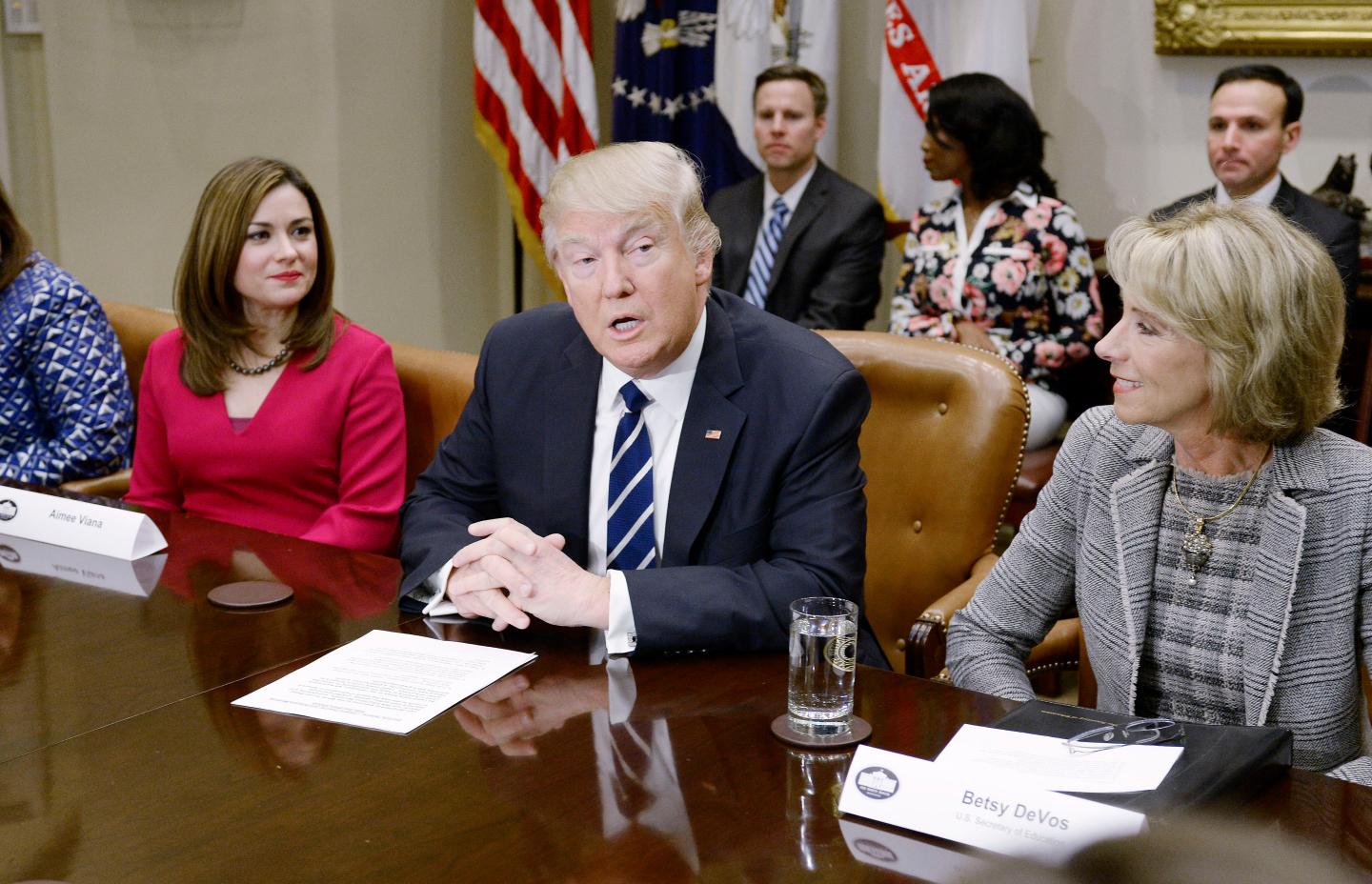 Donald Trump participates in a parent-teacher conference listenin