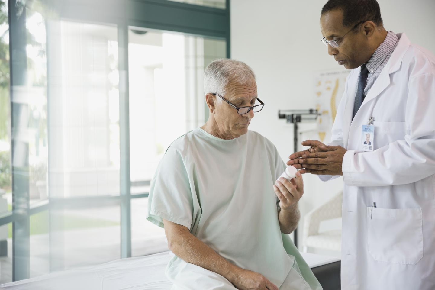 Doctor discussing prescription with senior patient