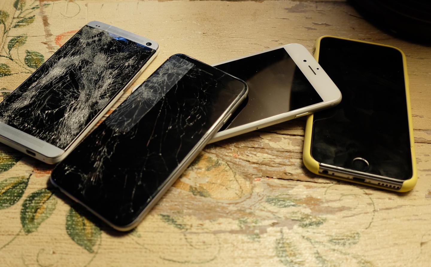 Pile of broken smartphones