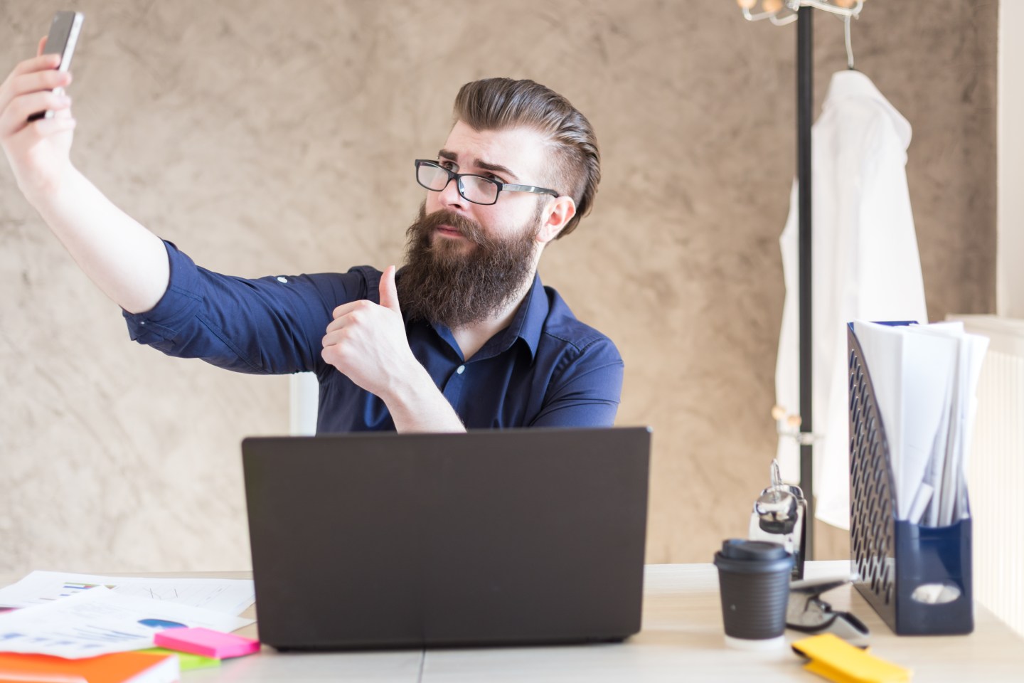 Taking a selfie in the office.