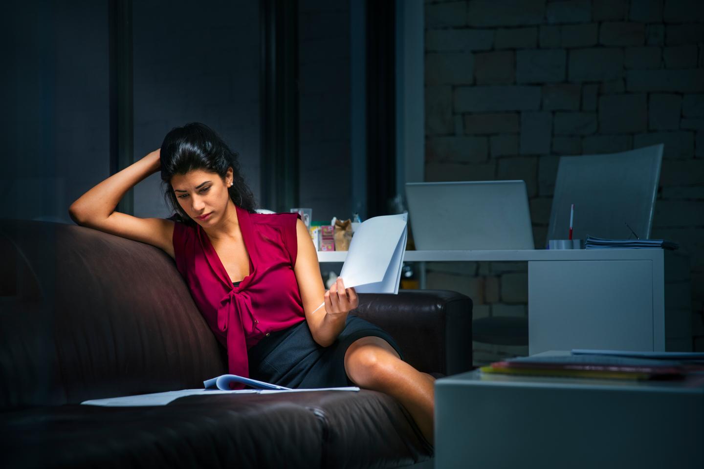 Businesswoman at the office working late.