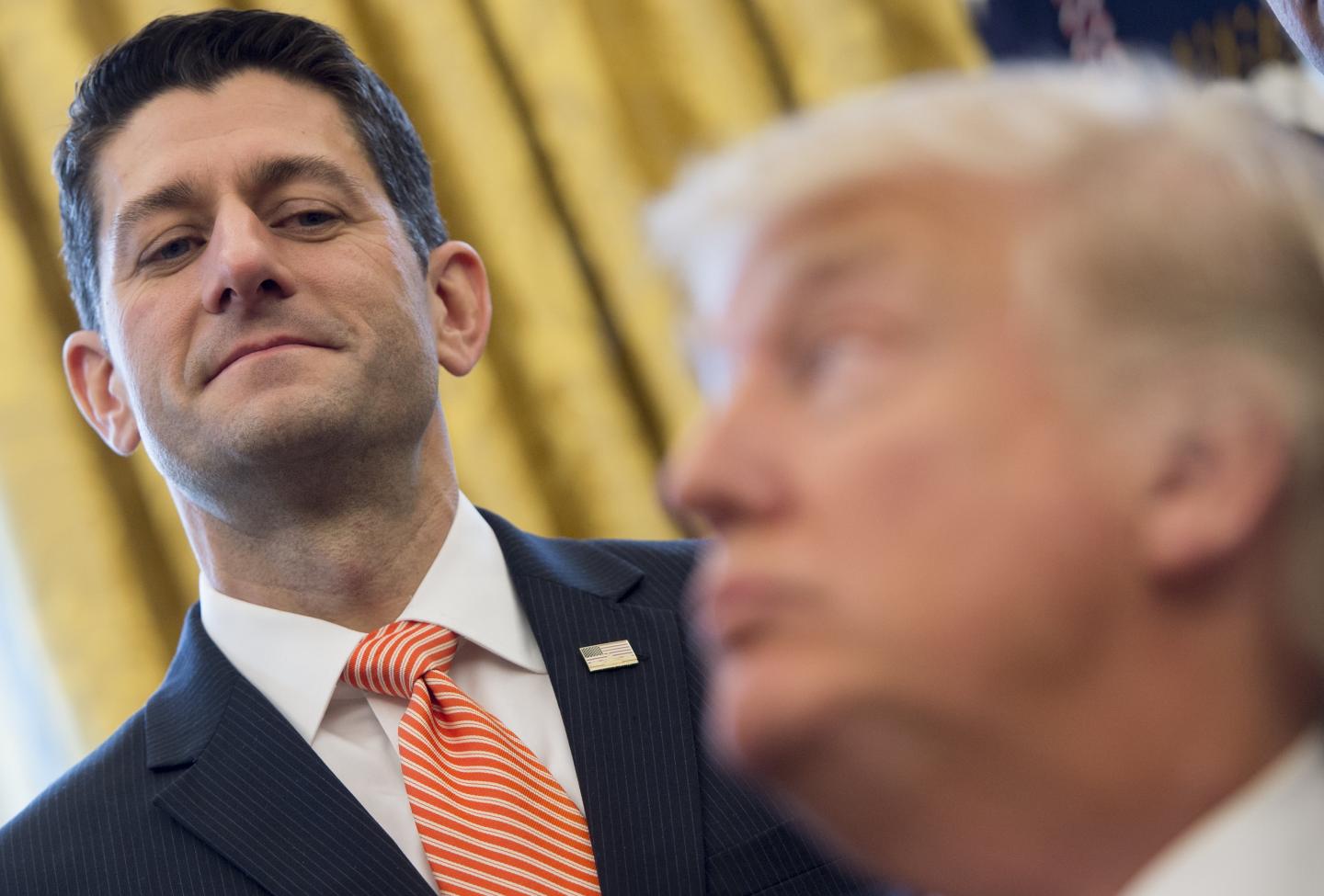 TOPSHOT-US-POLITICS-TRUMP-SIGNING
