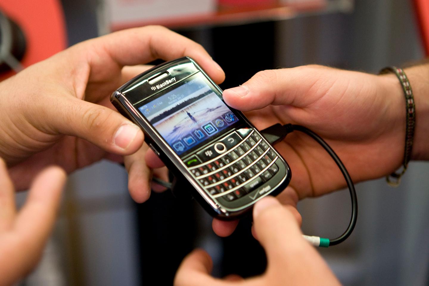 A customer is shown a Research In Motion Ltd. Blackberry pho