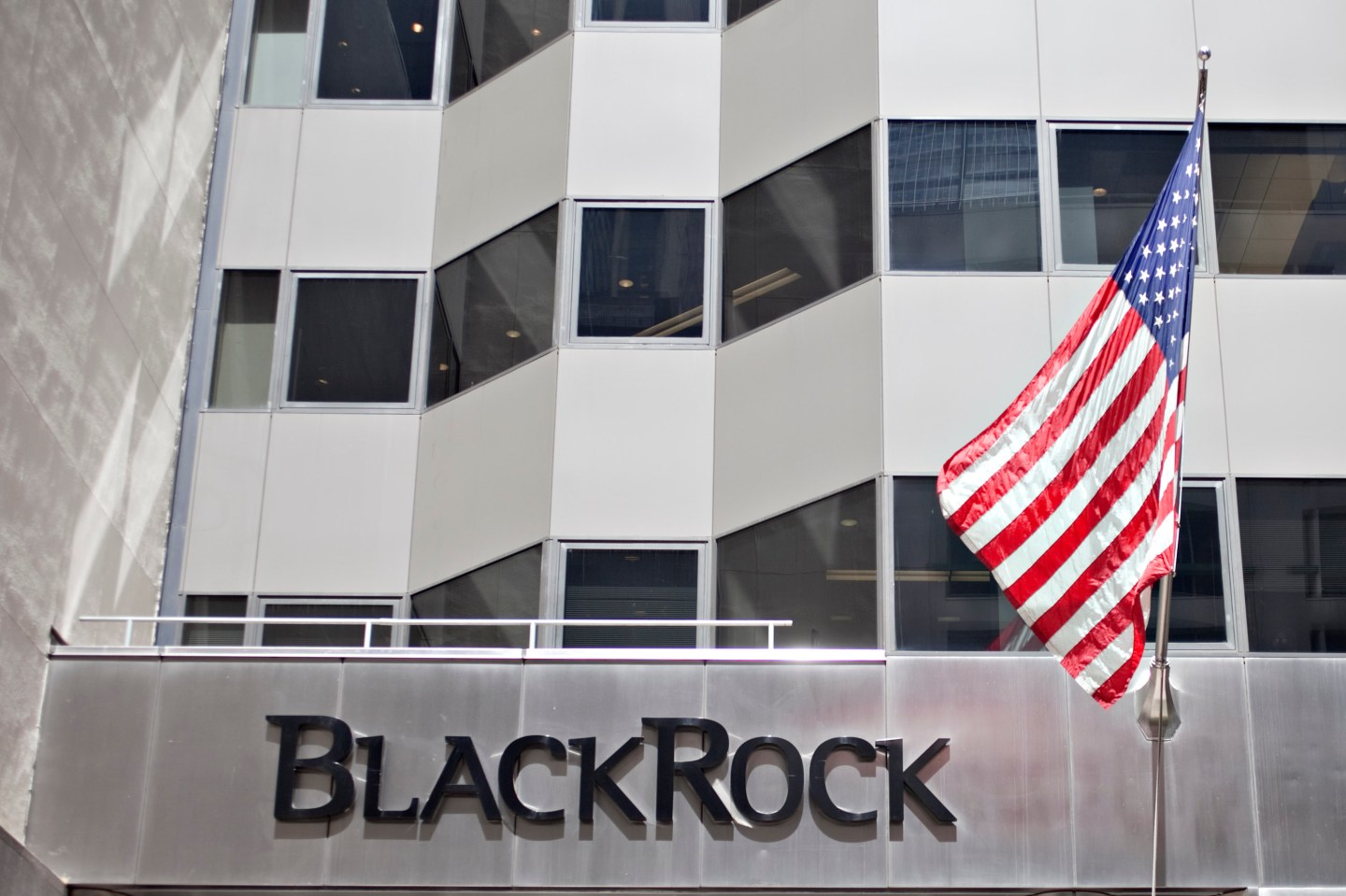 A U.S. flag flies outside the headquarters of BlackRock Inc.