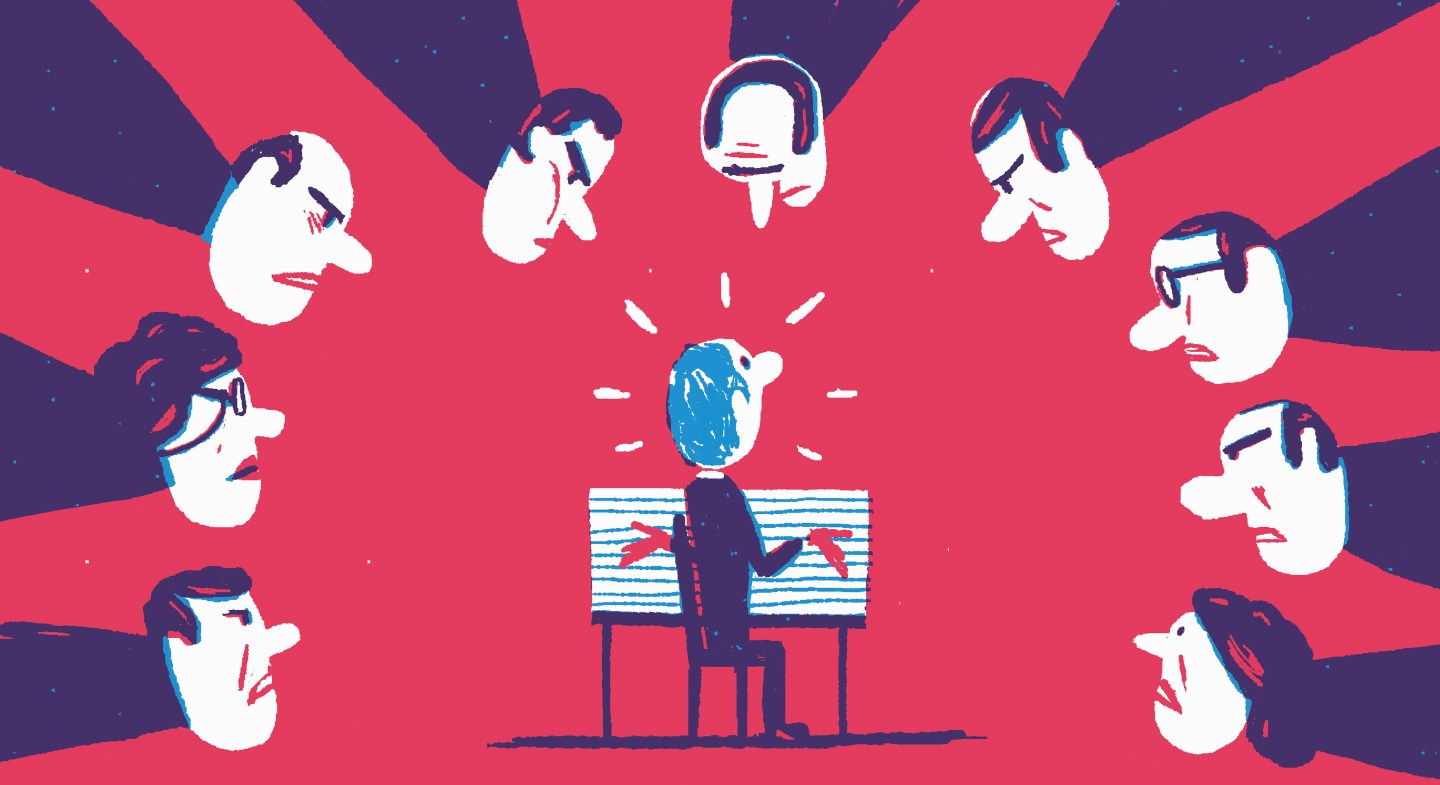 Stressed man being interrogated by hostile committee