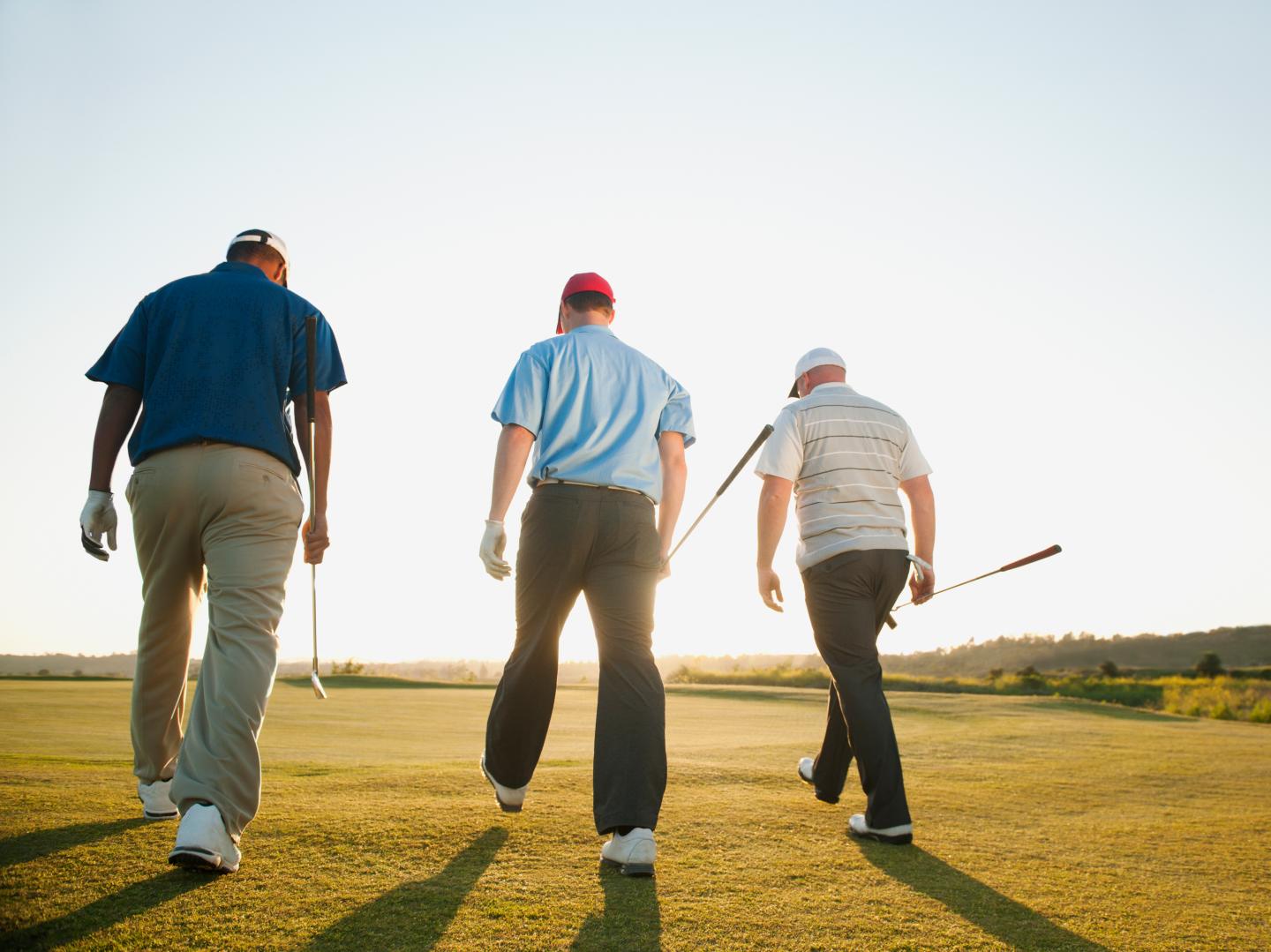 Golfers walking together on golf course