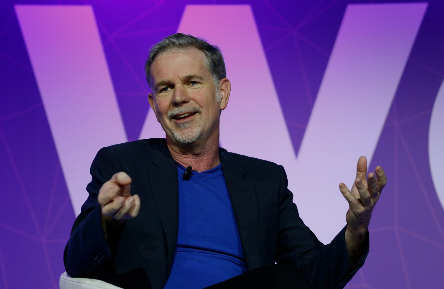 Netflix's CEO Hastings gestures as he delivers his keynote speech during Mobile World Congress in Barcelona