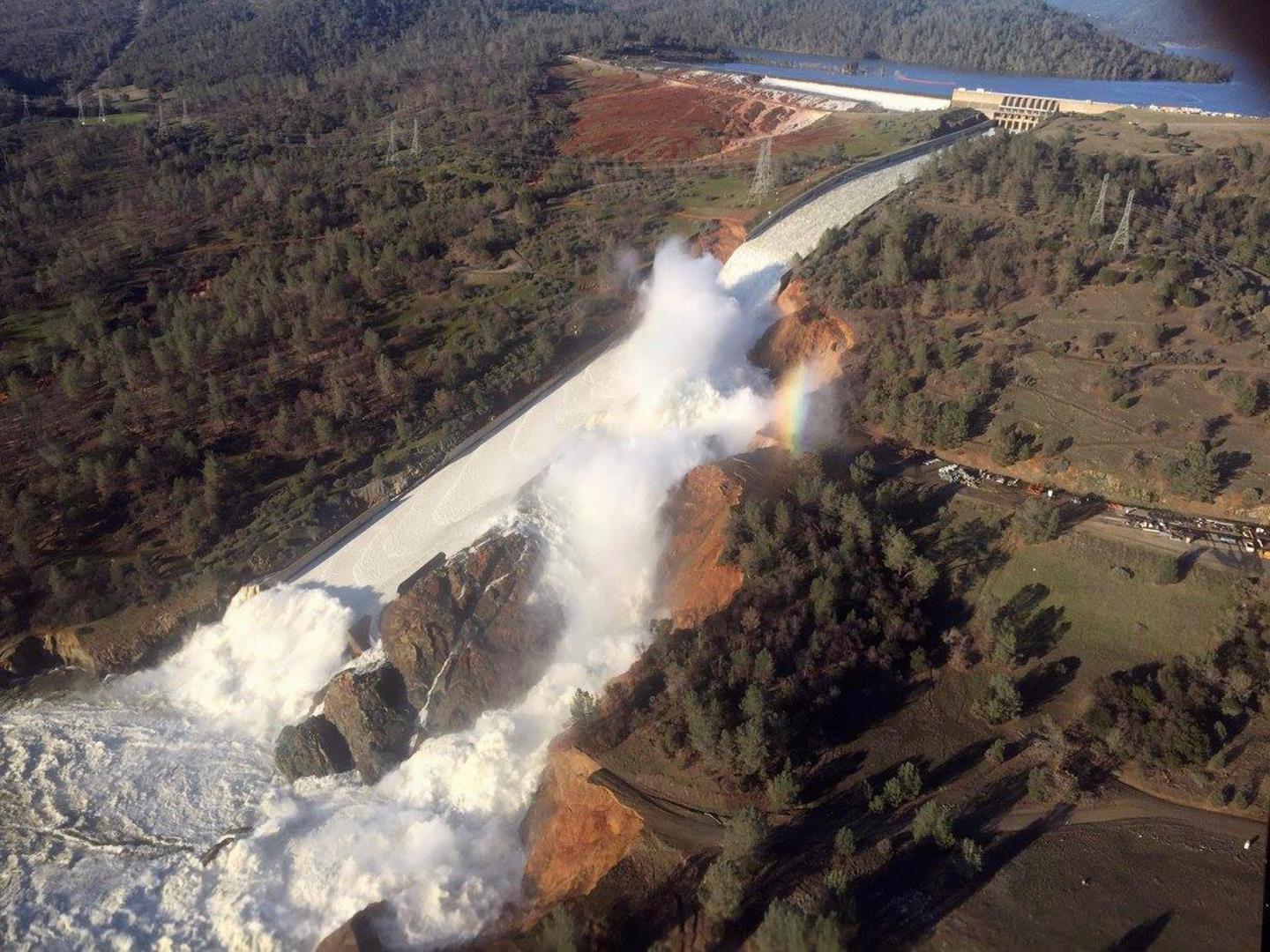 A damaged spillway with eroded hillside is seen in an aerial photo taken over the Oroville Dam in Oroville