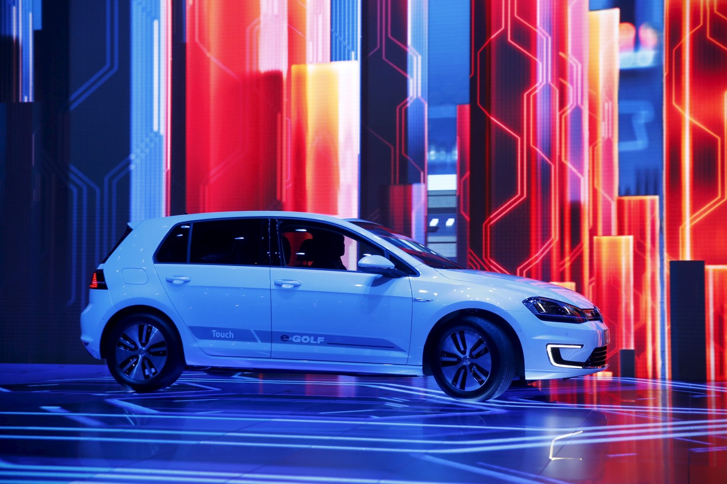 The Volkswagen e-Golf Touch electric vehicle is driven onstage during Herbert Diess' keynote address at the 2016 CES trade show in Las Vegas