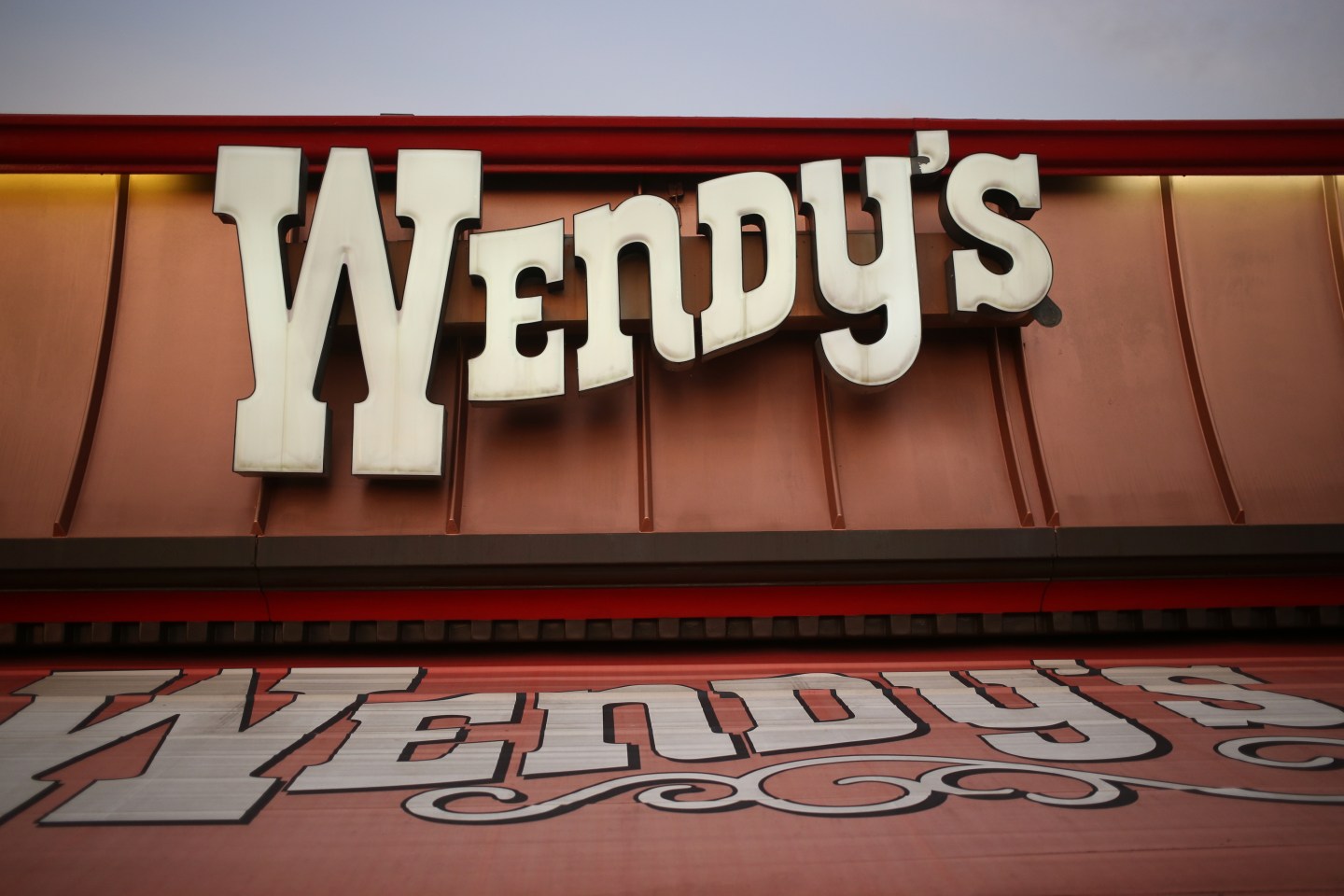 Signage is displayed outside a Wendy's Co. restaurant in Mt. Vernon, Illinois, U.S., on Wednesday, July 29, 2015.