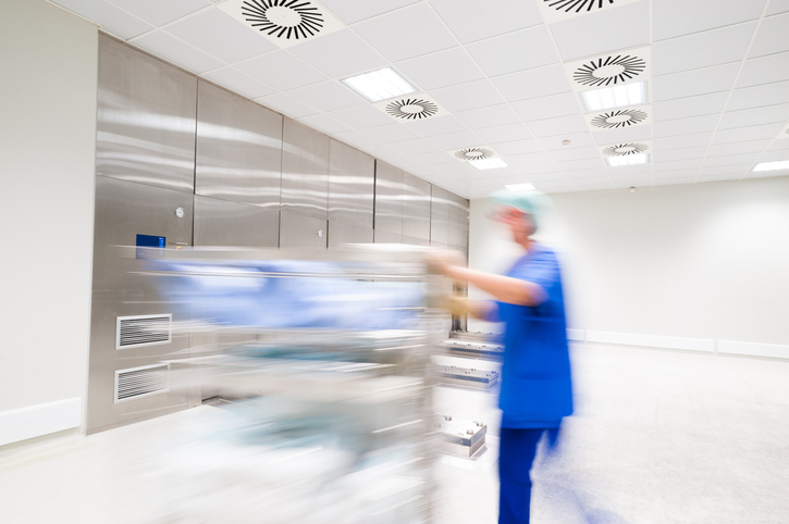 Germany, Wuppertal, Nurse pushing hospital gurney
