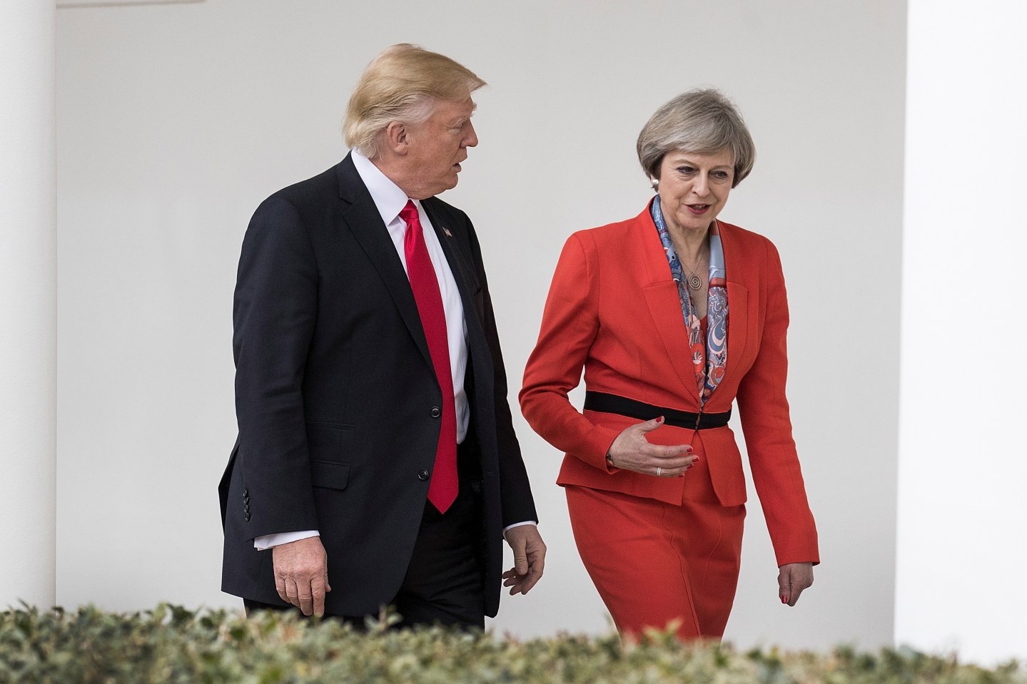 British Prime Minister Theresa May and U.S. President Donald Trump walk along The Colonnade of the West Wing at The White House on January 27, 2017 in Washington, DC.