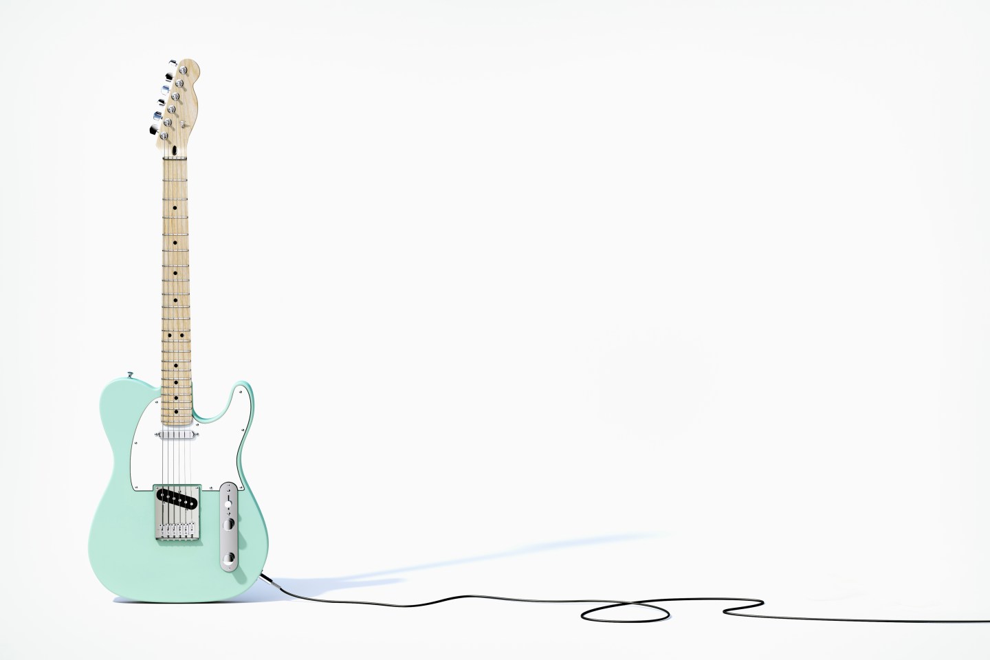 Green guitar balancing on white background