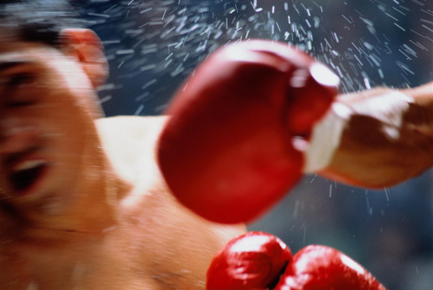 Boxer striking opponent (blurred motion)