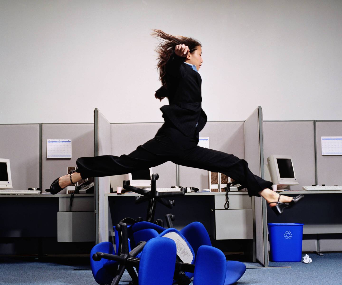 Successful businesswoman leaping to success