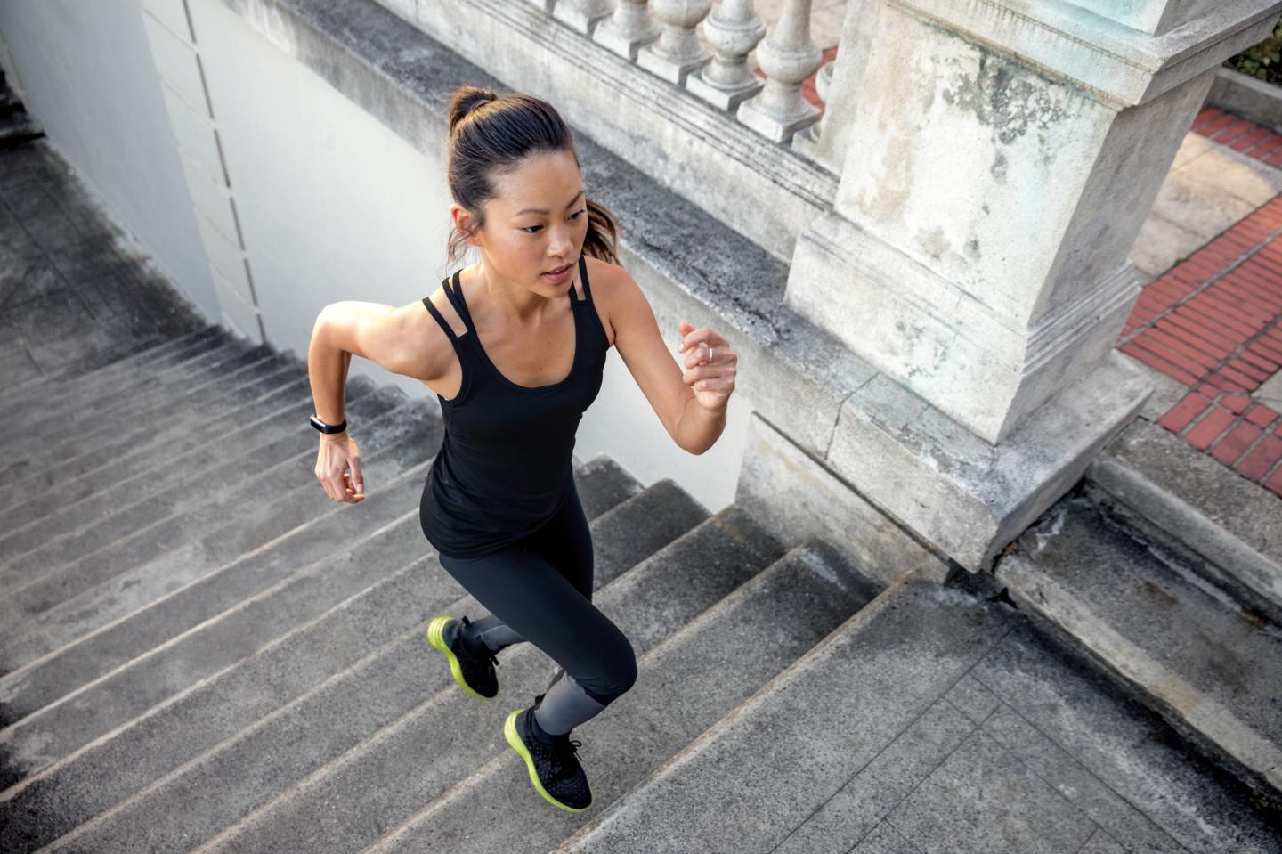 Runner wearing Fitbit Alta HR fitness tracker.